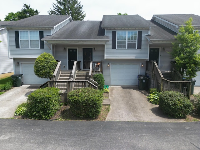 3659 Leisure Creek Ct, Lexington, KY 40517 - split level home featuring concrete driveway, a garage, and a porch