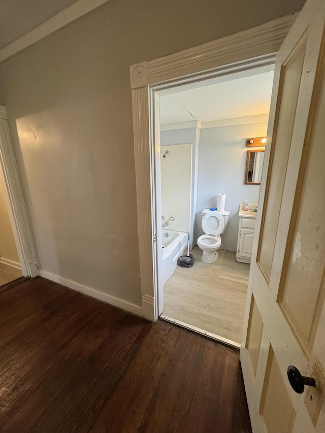 107 E N St, Carlisle, KY 40311 - hall featuring dark wood-style floors and baseboards