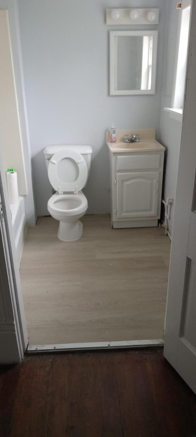 107 E N St, Carlisle, KY 40311 - half bath with vanity and wood finished floors