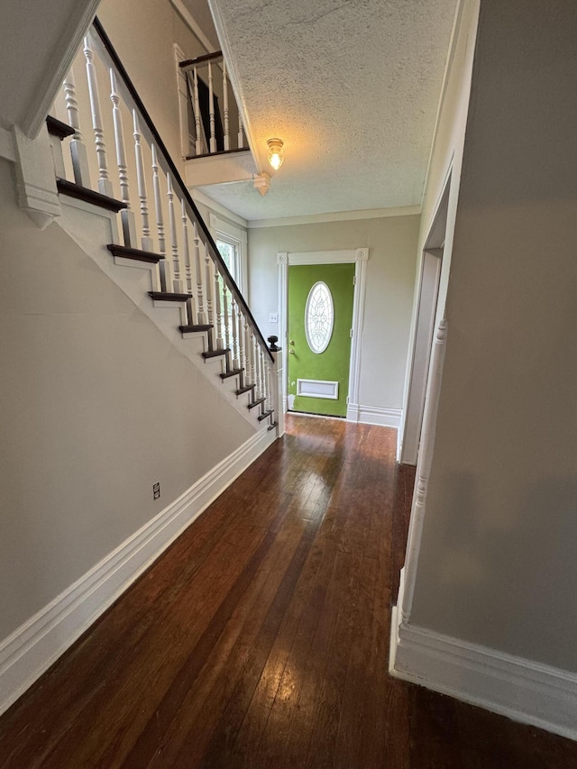 107 E N St, Carlisle, KY 40311 - entrance foyer featuring stairway, hardwood / wood-style floors, a textured ceiling, and ornamental molding
