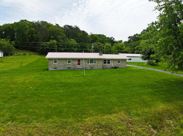 755 Mckee Rd, Irvine, KY 40336 - ranch-style home with a front lawn, metal roof, and a view of trees