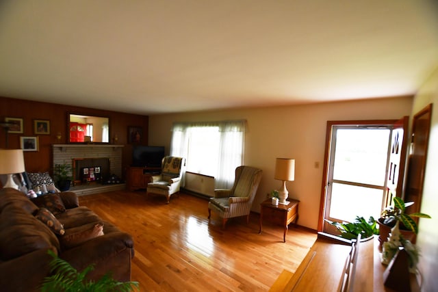 755 Mckee Rd, Irvine, KY 40336 - living area featuring a brick fireplace and light wood finished floors