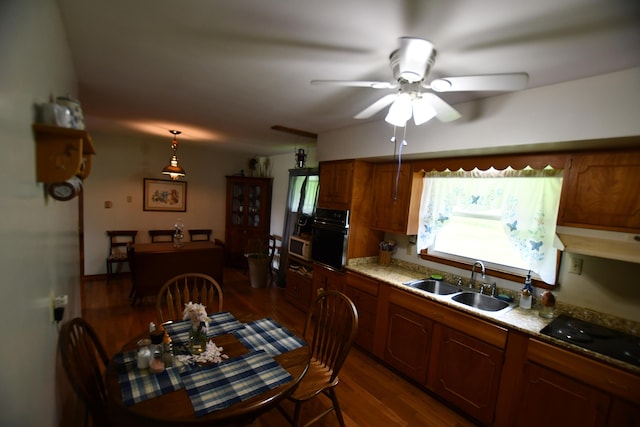 755 Mckee Rd, Irvine, KY 40336 - kitchen featuring a sink, black appliances, under cabinet range hood, ceiling fan, and brown cabinets
