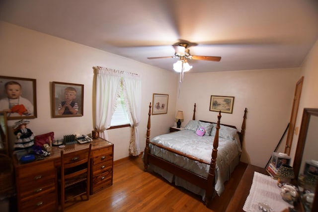 755 Mckee Rd, Irvine, KY 40336 - bedroom with wood finished floors, ceiling fan, and a desk