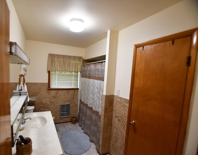 755 Mckee Rd, Irvine, KY 40336 - full bathroom with tile walls, a wainscoted wall, vanity, toilet, and a shower with curtain
