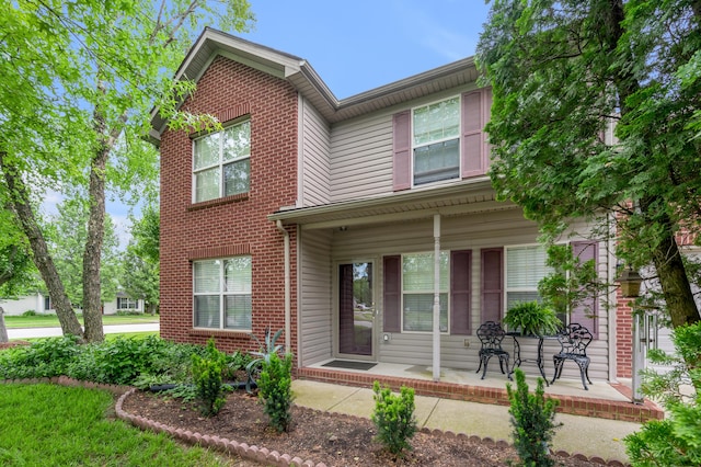 356 Weslyn Way, Nicholasville, KY 40356 - traditional-style home featuring covered porch and brick siding