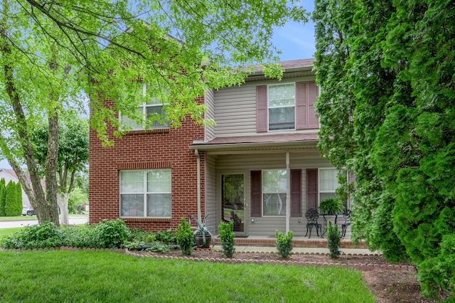 356 Weslyn Way, Nicholasville, KY 40356 - view of front of home featuring covered porch, a front yard, and brick siding