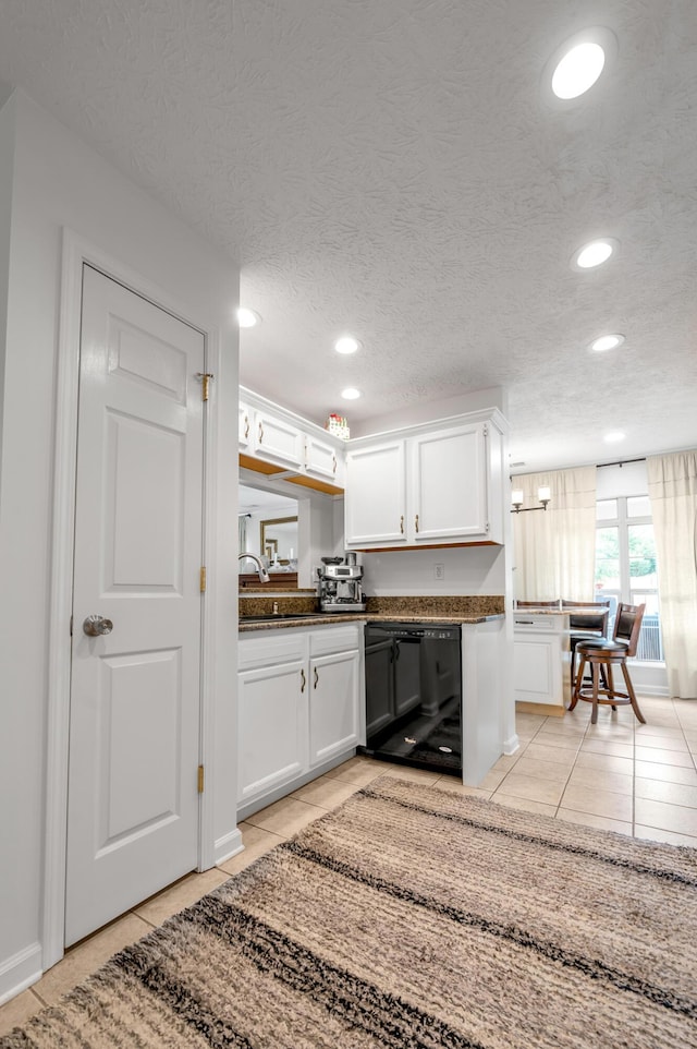 356 Weslyn Way, Nicholasville, KY 40356 - kitchen with light tile patterned flooring, white cabinetry, recessed lighting, a textured ceiling, and dark countertops