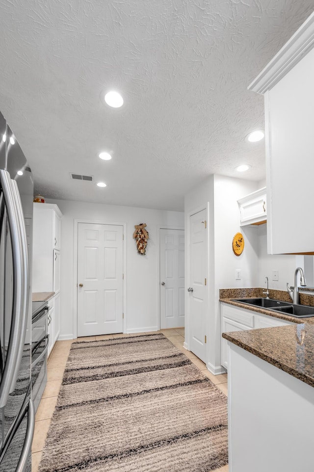 356 Weslyn Way, Nicholasville, KY 40356 - kitchen with a sink, stainless steel refrigerator, white cabinetry, recessed lighting, and light tile patterned flooring