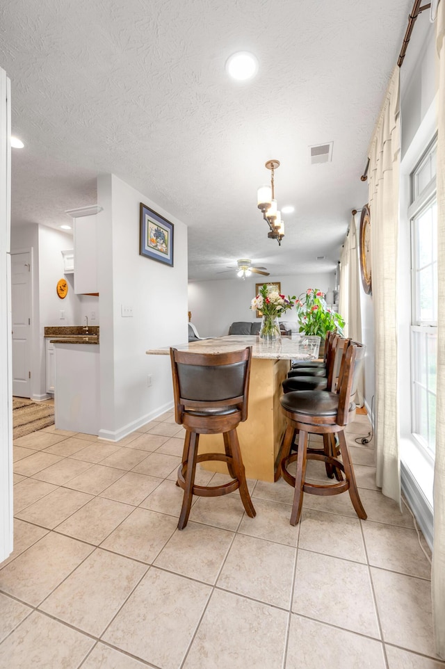 356 Weslyn Way, Nicholasville, KY 40356 - dining room featuring light tile patterned floors, plenty of natural light, a textured ceiling, recessed lighting, and baseboards