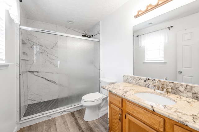 356 Weslyn Way, Nicholasville, KY 40356 - full bath with toilet, a marble finish shower, wood finished floors, healthy amount of natural light, and a textured ceiling