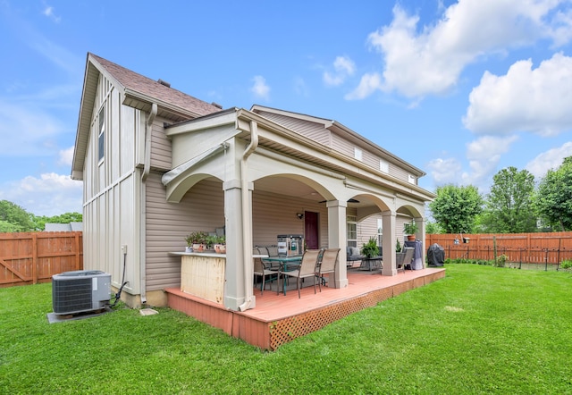 356 Weslyn Way, Nicholasville, KY 40356 - back of property with a deck, cooling unit, and outdoor dining area