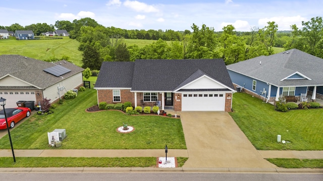 281 Meridian Way, Richmond, KY 40475 - traditional-style home with an attached garage, brick siding, driveway, and a front lawn