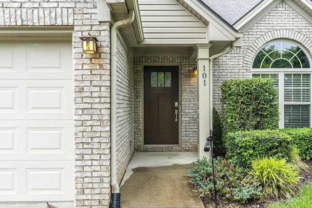 101 Brookford Way, Georgetown, KY 40324 - view of exterior entry with a garage and brick siding