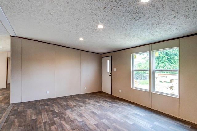 2832 Two Mile Rd, Winchester, KY 40391 - unfurnished room featuring wood finished floors, a textured ceiling, a decorative wall, recessed lighting, and crown molding