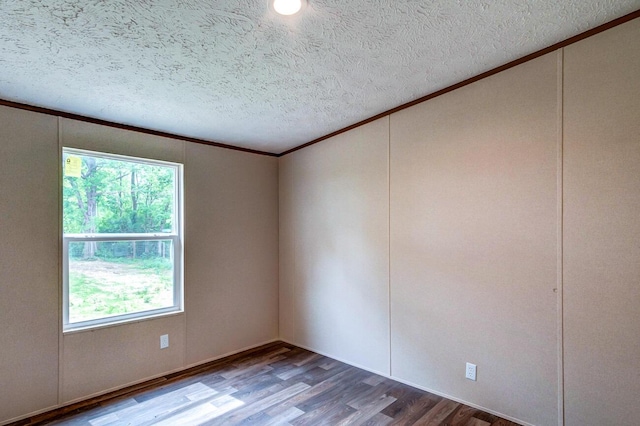 2832 Two Mile Rd, Winchester, KY 40391 - empty room with crown molding, wood finished floors, plenty of natural light, and a textured ceiling