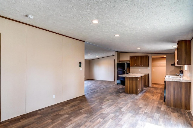 2832 Two Mile Rd, Winchester, KY 40391 - kitchen featuring freestanding refrigerator, dark wood finished floors, a sink, light countertops, and a kitchen island