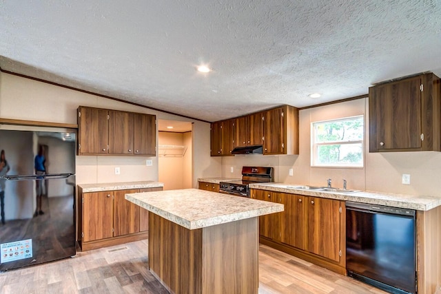 2832 Two Mile Rd, Winchester, KY 40391 - kitchen featuring dishwashing machine, freestanding refrigerator, stainless steel range with electric stovetop, under cabinet range hood, and a textured ceiling