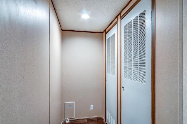 2832 Two Mile Rd, Winchester, KY 40391 - hallway featuring a heating unit, wood finished floors, a textured ceiling, and ornamental molding