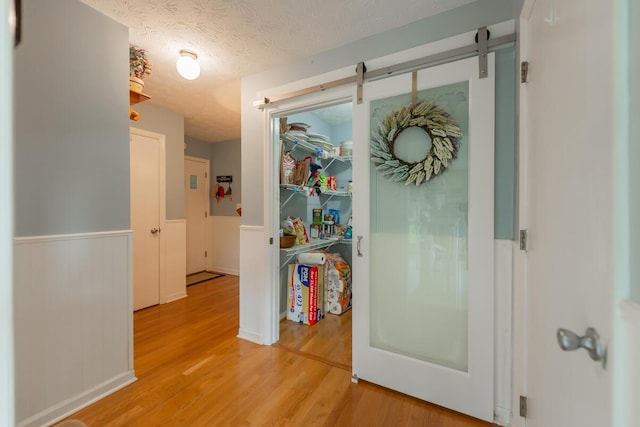 874 Sebree Rd, Stamping Ground, KY 40379 - hallway featuring wainscoting and light wood-style flooring