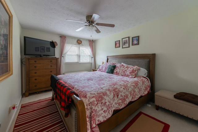 874 Sebree Rd, Stamping Ground, KY 40379 - bedroom featuring light carpet, a textured ceiling, and a ceiling fan