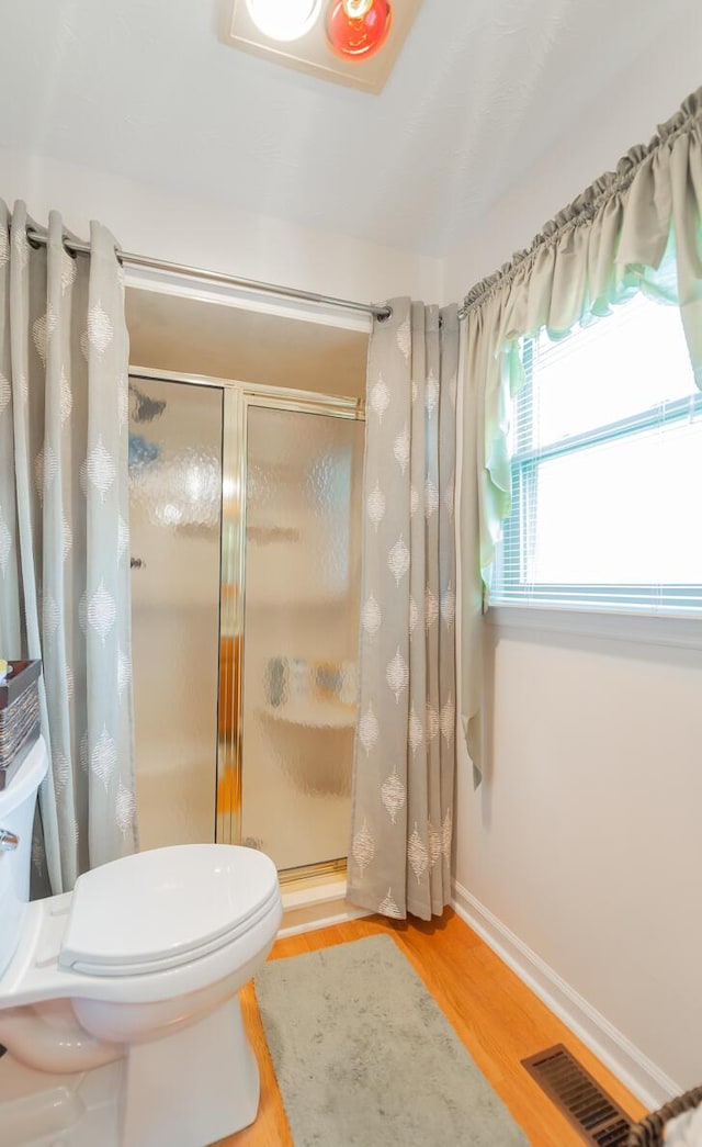 874 Sebree Rd, Stamping Ground, KY 40379 - full bathroom with a shower stall, wood finished floors, toilet, and baseboards