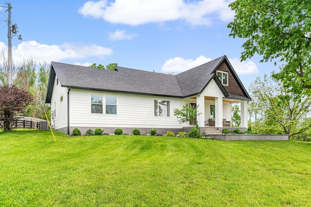 1251 Wilmore Rd, Nicholasville, KY 40356 - view of front of house with covered porch, a front yard, a shingled roof, and central air condition unit