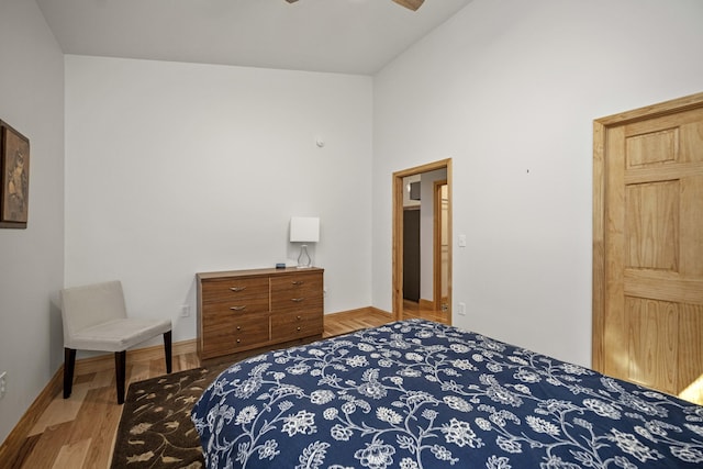 3786 Shoemaker Rdg, Beattyville, KY 41311 - bedroom featuring wood finished floors, vaulted ceiling, baseboards, and a ceiling fan