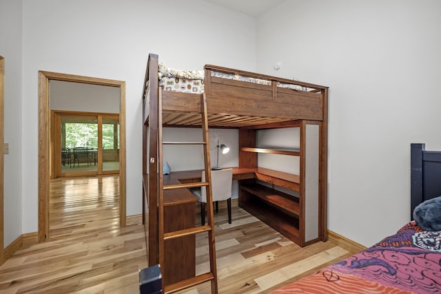 3786 Shoemaker Rdg, Beattyville, KY 41311 - bedroom with light wood-style flooring, baseboards, and a desk