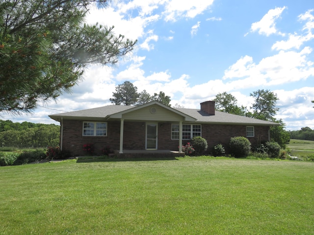 498 Winding Blade Rd, East Bernstadt, KY 40729 - single story home with a front lawn, brick siding, and a chimney