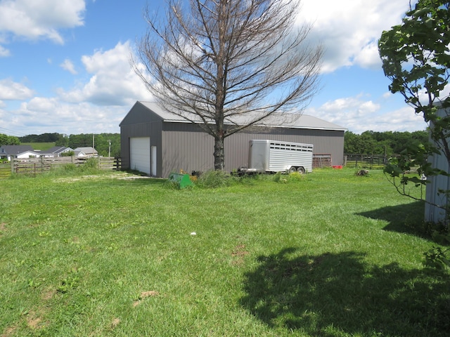 498 Winding Blade Rd, East Bernstadt, KY 40729 - view of yard featuring a detached garage and an outbuilding