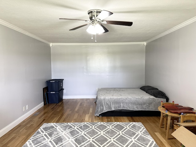 498 Winding Blade Rd, East Bernstadt, KY 40729 - bedroom featuring crown molding, wood finished floors, baseboards, and a ceiling fan