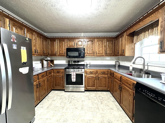 498 Winding Blade Rd, East Bernstadt, KY 40729 - kitchen with black appliances, a sink, light flooring, brown cabinetry, and a textured ceiling