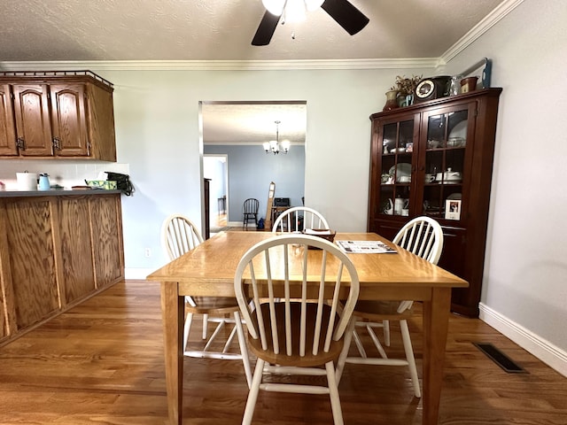 498 Winding Blade Rd, East Bernstadt, KY 40729 - dining room with a ceiling fan, ornamental molding, light wood finished floors, baseboards, and a chandelier