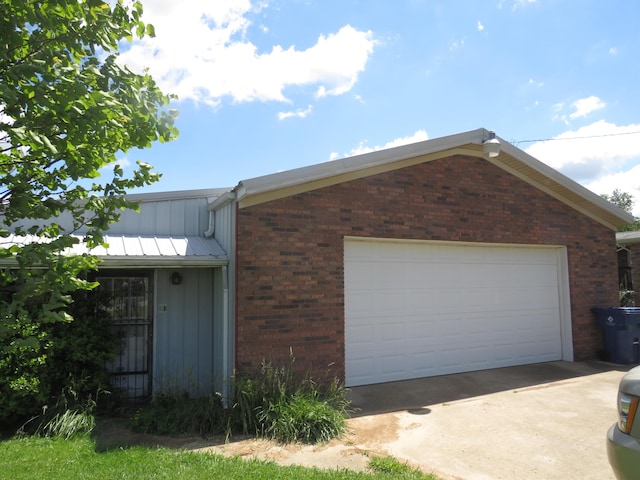 498 Winding Blade Rd, East Bernstadt, KY 40729 - view of front facade with board and batten siding, brick siding, and driveway