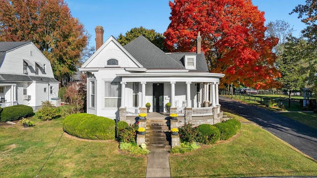 1483 Cypress St, Paris, KY 40361 - view of front of house with covered porch, a front lawn, and a chimney