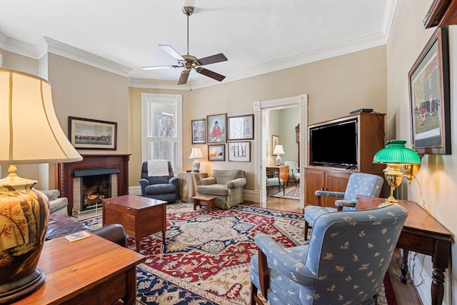 1483 Cypress St, Paris, KY 40361 - living area featuring ceiling fan, a brick fireplace, crown molding, wood finished floors, and baseboards