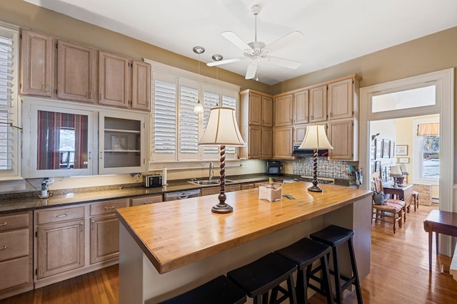 1483 Cypress St, Paris, KY 40361 - kitchen featuring butcher block counters, a sink, ceiling fan, a breakfast bar, and healthy amount of natural light