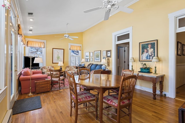 1483 Cypress St, Paris, KY 40361 - dining room featuring a ceiling fan, a baseboard heating unit, crown molding, wood finished floors, and lofted ceiling