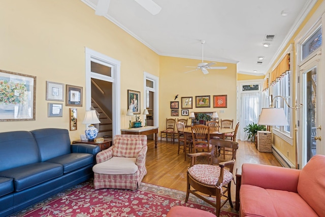 1483 Cypress St, Paris, KY 40361 - living area featuring a ceiling fan, ornamental molding, wood finished floors, a baseboard heating unit, and vaulted ceiling