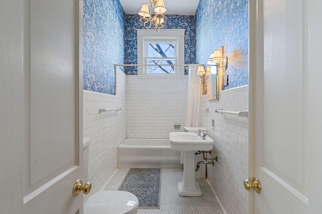 1483 Cypress St, Paris, KY 40361 - bathroom with wallpapered walls, wainscoting, tile walls, tile patterned flooring, and a chandelier