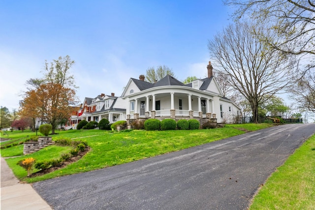 1483 Cypress St, Paris, KY 40361 - view of front facade featuring a porch, a chimney, and a front yard