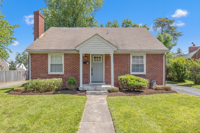 359 Stratford Dr, Lexington, KY 40503 - bungalow-style house featuring brick siding, a chimney, and a shingled roof