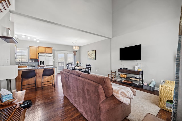 929 Lauderdale Dr, Lexington, KY 40515 - living room featuring dark wood finished floors, baseboards, and a chandelier