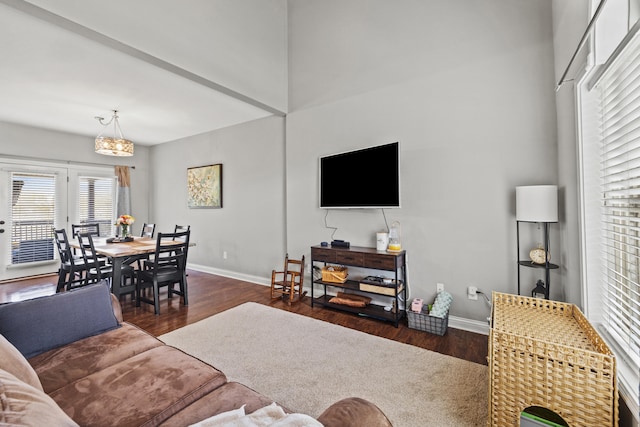 929 Lauderdale Dr, Lexington, KY 40515 - living room with dark wood-type flooring, a chandelier, and baseboards