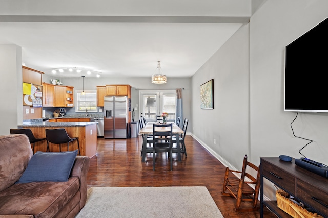 929 Lauderdale Dr, Lexington, KY 40515 - dining space with healthy amount of natural light, dark wood-type flooring, and baseboards