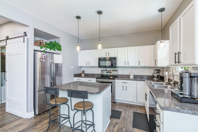 4716 Boca Ln, Lexington, KY 40515 - kitchen featuring appliances with stainless steel finishes, a sink, dark wood-type flooring, tasteful backsplash, and white cabinets