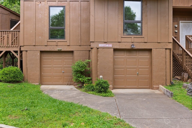 42-1 Woodson Bend Resort, Bronston, KY 42518 - view of front facade with an attached garage, stairway, and driveway