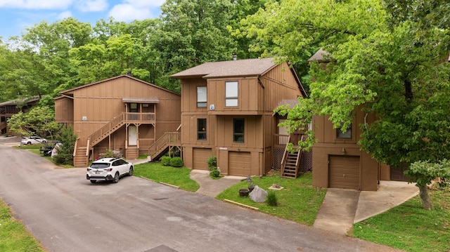 42-1 Woodson Bend Resort, Bronston, KY 42518 - chalet / cabin with stairs, an attached garage, and asphalt driveway