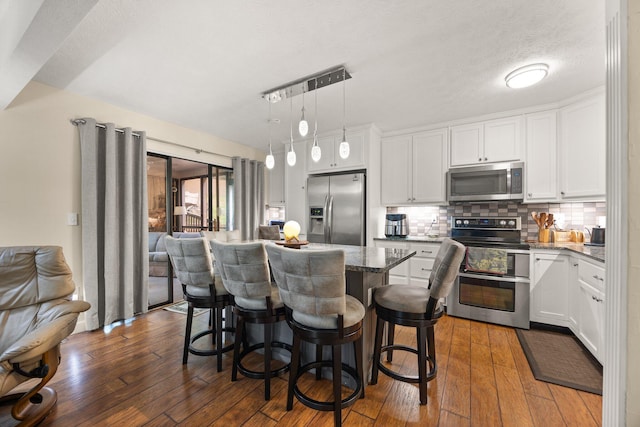 42-1 Woodson Bend Resort, Bronston, KY 42518 - kitchen with appliances with stainless steel finishes, dark wood-style floors, and white cabinetry